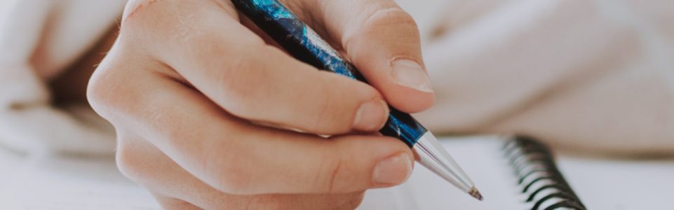 Woman writing a paper